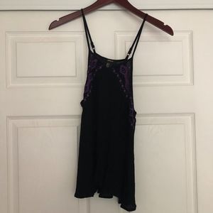 Black tank with purple embellishment on top